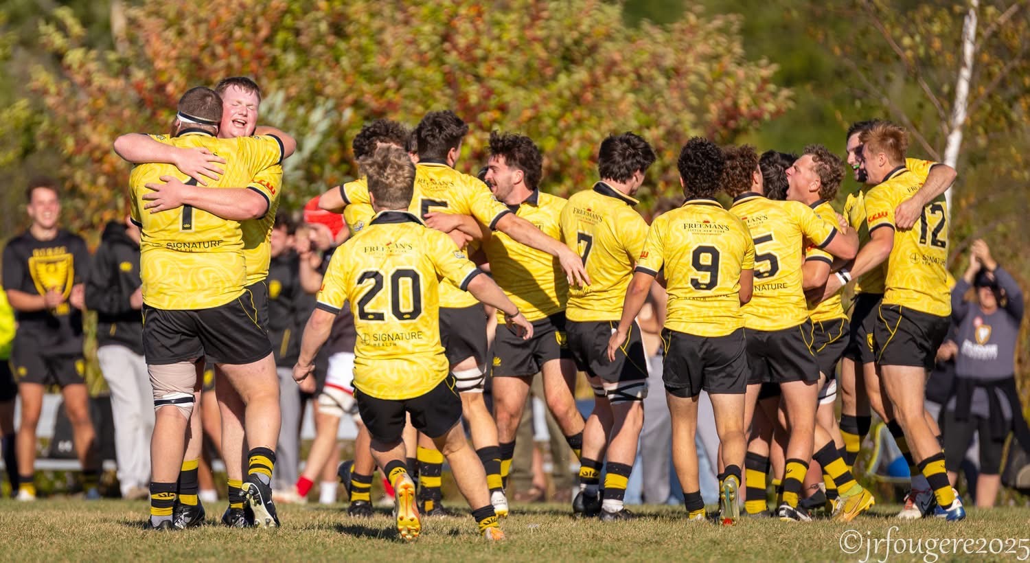 Dal Rugby players celebrating together after a match